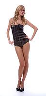Portrait of beautiful blonde model poses in polka-dot body on white [IBR124968449]