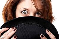 Young woman with hat isolated on the black background [IBR124968451]
