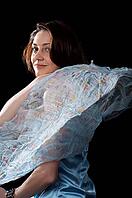 Woman in blue peignoir isolated on the black background [IBR124968453]