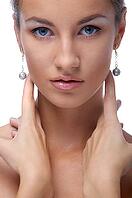 Close-up portrait of beautiful blue eyed caucasian model on white [IBR124968455]