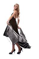 Portrait of beautiful blonde model poses in black dress with shawl [IBR124968460]
