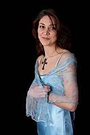 Woman in blue peignoir isolated on the black background [IBR124968477]