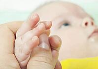 The hand of the child gently lays [IBR124991079]