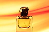 Bottle with parfumom on a beautiful backdrop [IBR124991126]