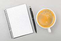 Creative process. blank notebook and cup on gray [IBR125000239]
