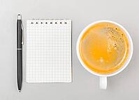 Creative process. blank notebook and cup on gray [IBR125000240]
