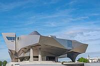 A spectacular close-up of the deconstructivist Musée des Confluences, designed by the Viennese architectural firm Coop Himmelb (l) au, featuring monumental cantilevers, asymmetrical angles and a gleaming stainless steel façade, an architectural landmark o [IBR125002333]