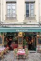 Terrace of the traditional Bouchon Pralyon on the sidewalk of Rue Saint-Jean in the Vieux Lyon district with red and white checkered tablecloths, typical bistro chairs and a handwritten menu with Lyonese specialities, Lyon, Rhone, Auvergne-Rhone-Alpes, Fr [IBR125002340]