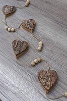 Wooden hearts, strung on a cord, Kempen, Viersen District, North Rhine-Westphalia, Germany [IBR125007576]