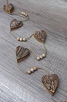Wooden hearts, strung on a cord, Kempen, Viersen District, North Rhine-Westphalia, Germany [IBR125007577]