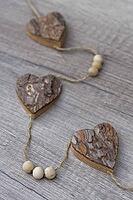 Wooden hearts, strung on a cord, Kempen, Viersen District, North Rhine-Westphalia, Germany [IBR125007586]