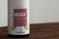 Bottle with organic rose flower plant water, Kempen, Viersen District, North Rhine-Westphalia, Germany [IBR125007651]