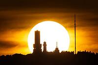 Seen from Frankfurt am Main, the sun sets behind the Großer Feldberg in the Taunus, Taunus, Schmitten, Hesse, Germany [IBR125026184]