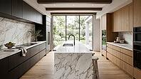 A spacious contemporary kitchen features a large marble island with a black faucet, dark wood cabinets, and a view of a lush green garden through expansive windows, AI generated [IBR125026405]