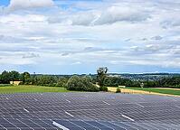 Clouds move over solar field in sunny skies, photovoltaic system on Lake Lake Ammer, Bavaria, Germany [IBR125030429]
