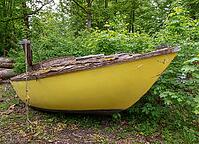 Old broken sailboat rots in landscape, pollution [IBR125030519]