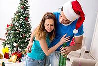 Young family celebrating christmas at home [IBR125053206]