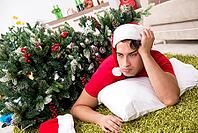 Young man drunk at home after christmas party [IBR125053208]