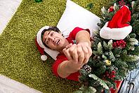 Young man drunk at home after christmas party [IBR125053216]