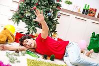 Young man drunk at home after christmas party [IBR125053217]