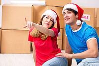 Young family celebrating christmas in new home [IBR125053218]