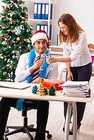 Colleagues celebrating christmas in office [IBR125053224]