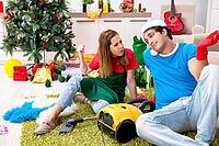 Young family cleaning apartment after christmas party [IBR125053230]
