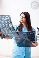 Young beautiful female doctor working in the clinic [IBR125053242]