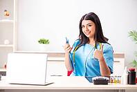 Young beautiful female doctor working in the clinic [IBR125053243]