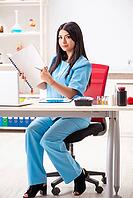 Young beautiful female doctor working in the clinic [IBR125053246]