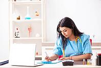 Young beautiful female doctor working in the clinic [IBR125053252]