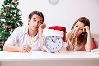 Young couple celebrating christmas at home [IBR125053259]
