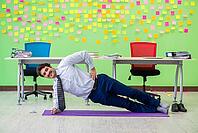 Man in the office with many conflicting priorities doing exercises [IBR125062161]