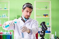 Man chemist working in the lab [IBR125062167]
