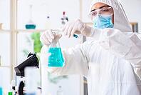 Young chemist student working in lab on chemicals [IBR125062168]