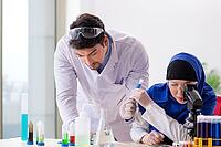 Two chemists working in the lab [IBR125062172]