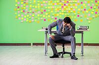 Businessman with many conflicting priorities [IBR125062192]
