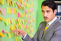 Businessman with many business priorities [IBR125062200]