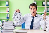 Businessman having problems with paperwork and workload [IBR125062201]
