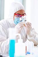 Young chemist student working in lab on chemicals [IBR125062209]