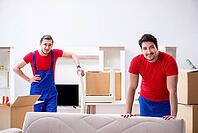 Two contractor employees moving personal belongings [IBR125062215]