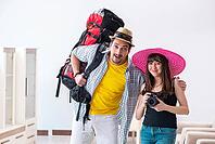 Young active pair preparing for honeymoon trip [IBR125062216]