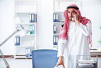 Arab businessman working in the office [IBR125062218]