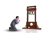 Businessman in heavy high taxes business concept [IBR125062224]