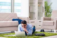 Businessman taking work home and working overtime [IBR125062225]