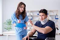 Man with neck injury visiting doctor for check-up [IBR125062232]
