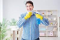 Man with neck unjury cleaning house in housekeeping concept [IBR125062236]