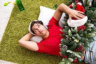 Young man drunk at home after christmas party [IBR125075734]