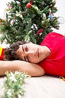 Young man drunk at home after christmas party [IBR125075752]