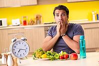 Young man in dieting and healthy eating concept [IBR125075765]